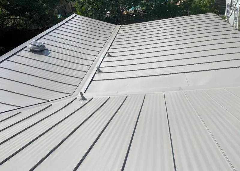 Solar attic fan installed on a metal roof for Roof Ventilation in Paloma Creek South